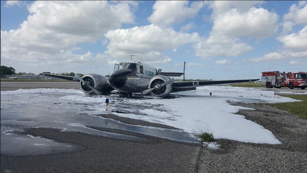 Twinengine plane crash lands, catches fire at Fort Lauderdale