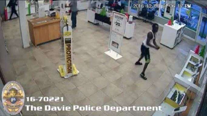 Surveillance captures thieves ripping away phones from Sprint store ...