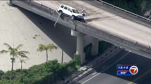 SUV drives on top of railing on Airport Expressway near I-95 - WSVN ...