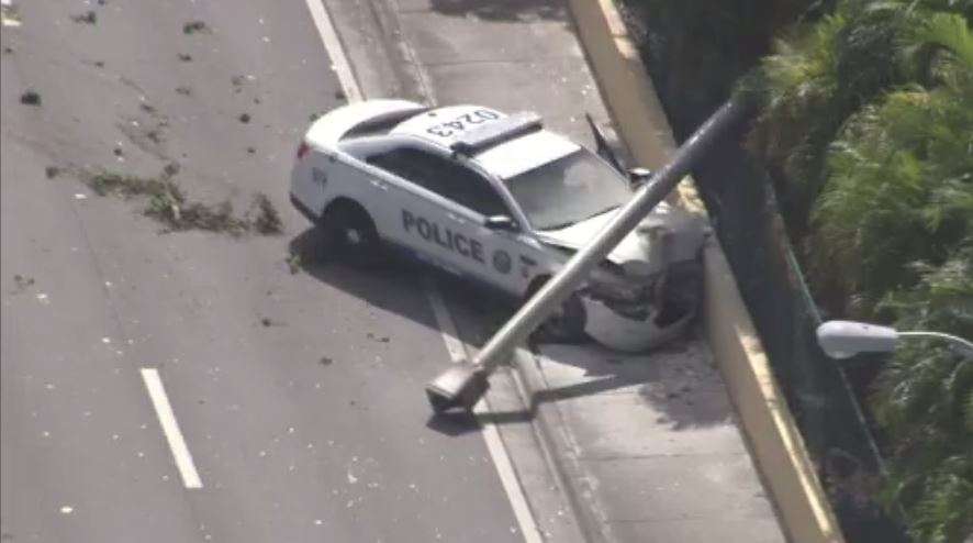 Police officer crashes into, knocks down light pole in Doral - WSVN ...