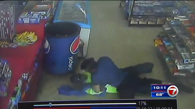 Surveillance video captures Hollywood clerk fighting off would be