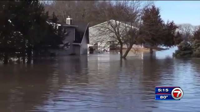 Rescues, evacuations as floodwaters breach levees in Midwest - WSVN ...