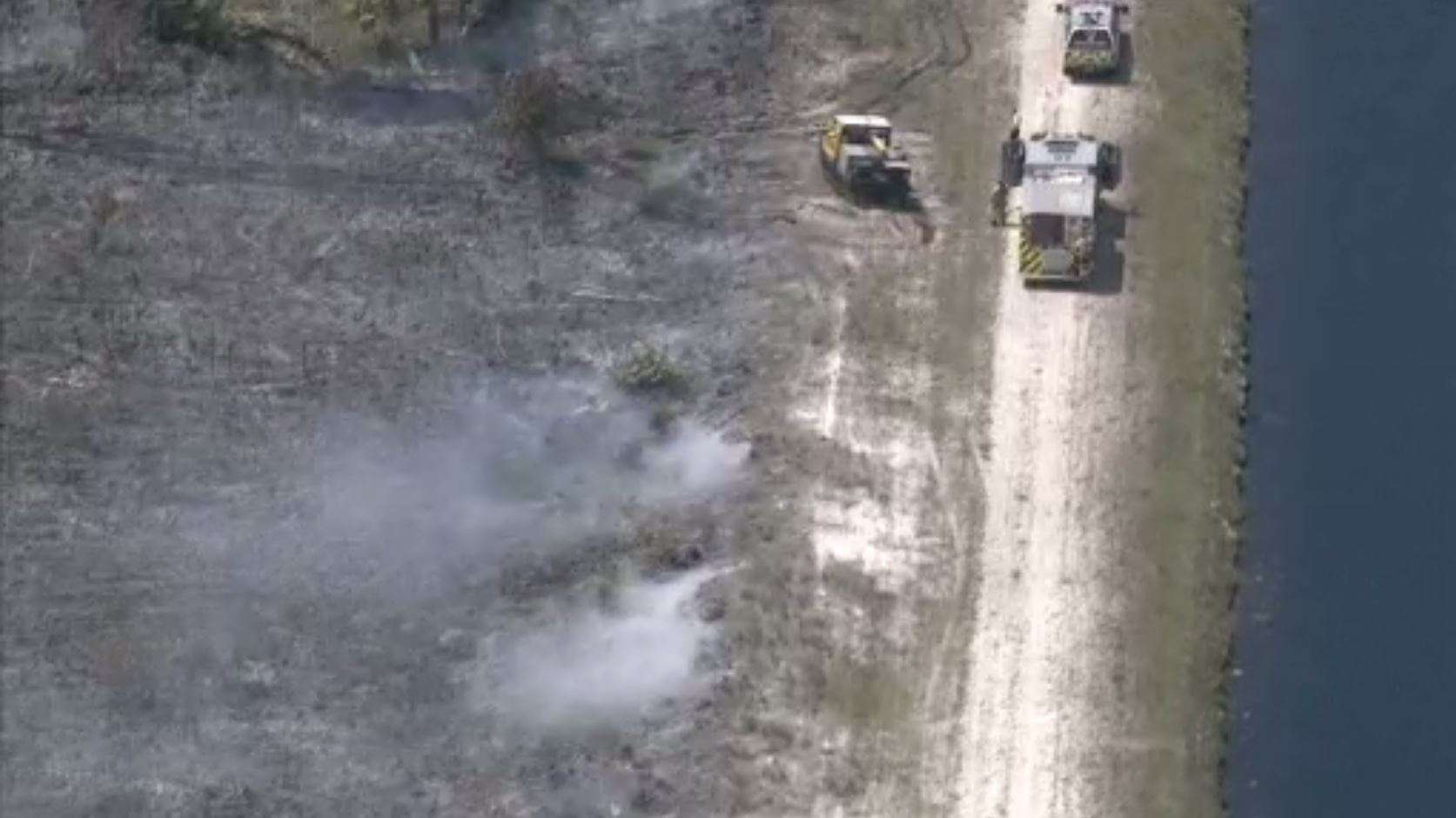 Brush fire burns about 10 acres of land in NW Miami-Dade - WSVN 7News ...