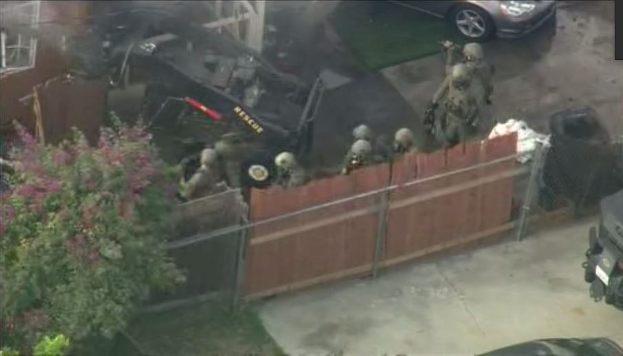 Gunman killed after bizarre standoff at burning LAarea home WSVN