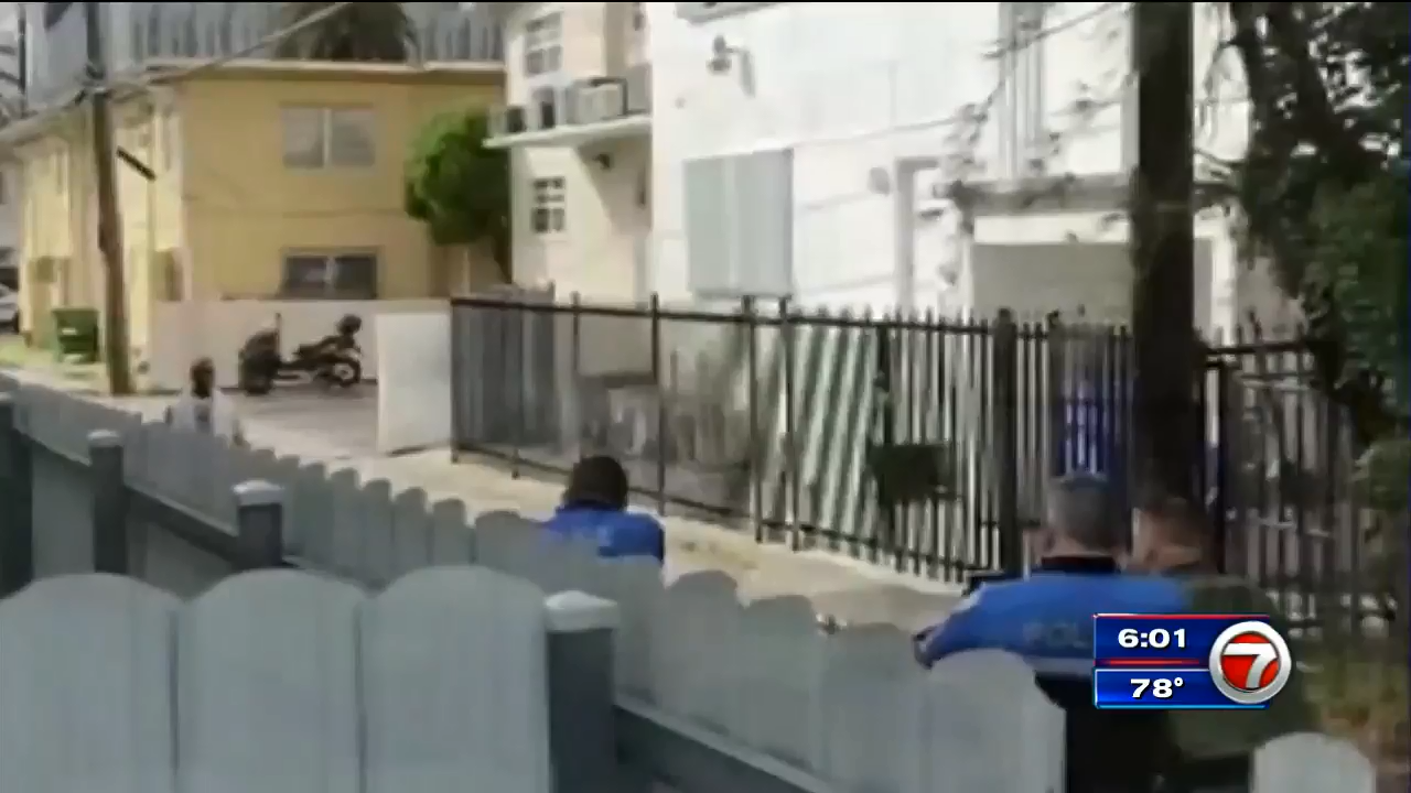 Cellphone video captures standoff between police, alleged armed robber