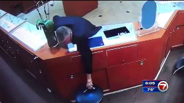 Thief caught on camera swiping pricey diamond bracelets from downtown ...