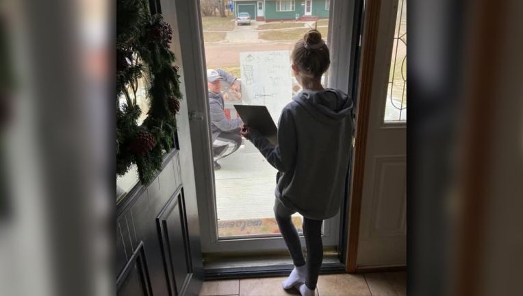 Math teacher uses whiteboard, helps student through glass ...