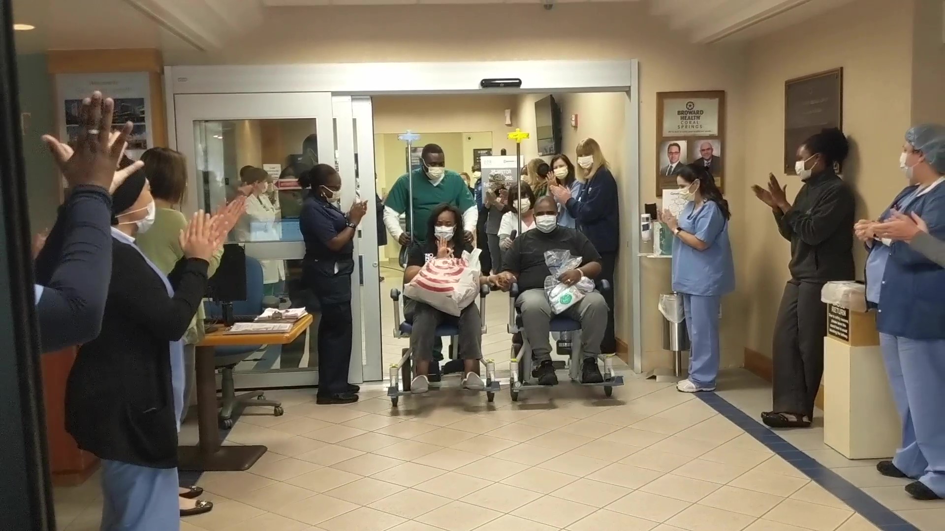 Broward Health employees cheer on couple leaving hospital after beating ...