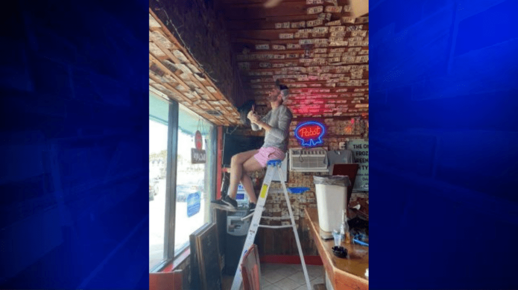 A bar owner removed 3,714 worth of bills stapled to the walls to give to her unemployed