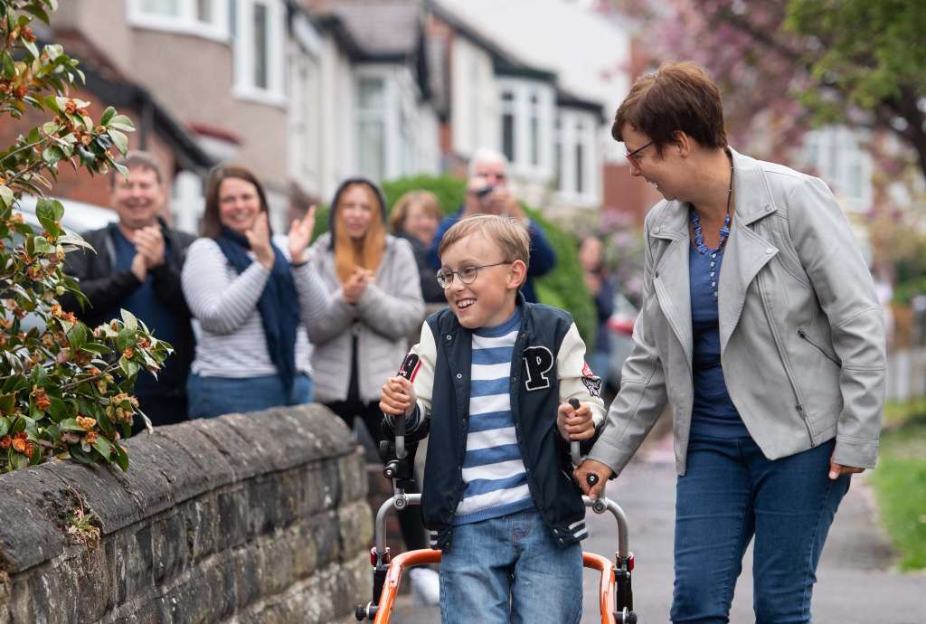 Boy, 9, with cerebral palsy completes marathon on his walker, half a