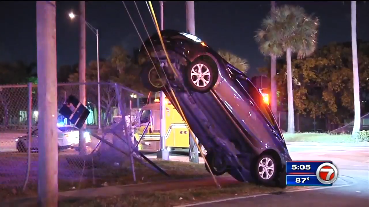 Driver handcuffed after car crashes into pole in NW Miami-Dade - WSVN ...