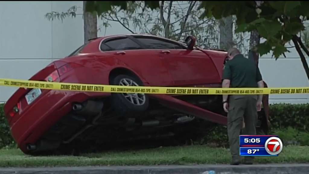 Woman dies after being found shot several times following car crash in