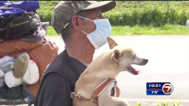 Homeless man reunited with missing dog following help from community ...