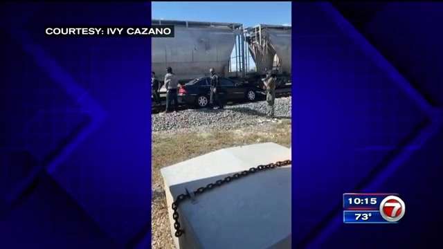 Driver OK after freight train hits car stuck on tracks in Deerfield ...