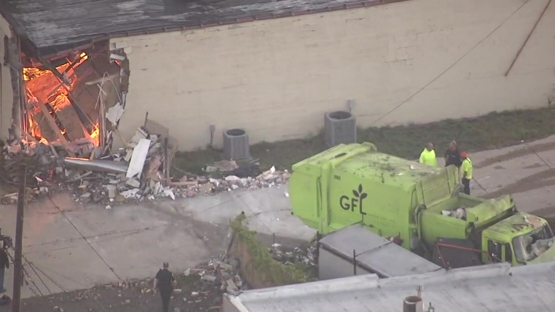 Garbage truck crashes into Michigan building, reveals illegal weed