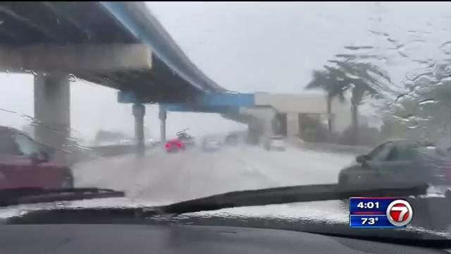 Street flooding, traffic headaches as downpours drench South Florida ...