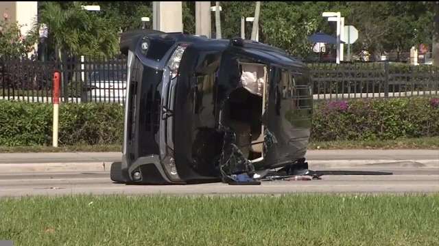 Suspected bank robber in custody after barricading self in crashed SUV ...
