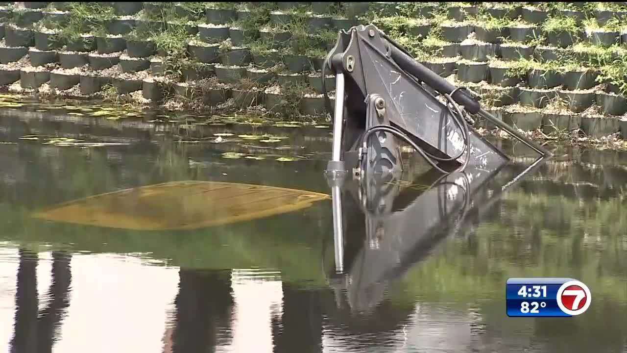 Construction vehicle crashes into canal in Doral - WSVN 7News | Miami ...
