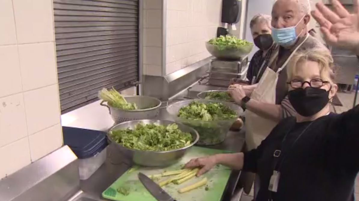 Volunteers with Greater Miami Jewish Federation serve gourmet meals at