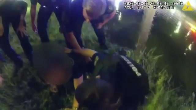 Bodycam video shows Orlando Police officers rescuing driver after SUV ...