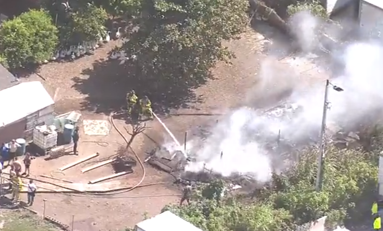 Crews work to put out tractor trailer fire at animal farm in NW Miami ...