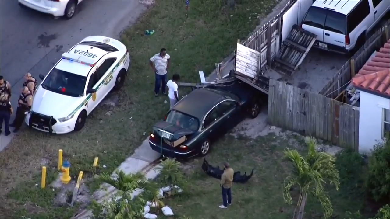 Car slams into fence outside North Miami Beach home; 1 treated for