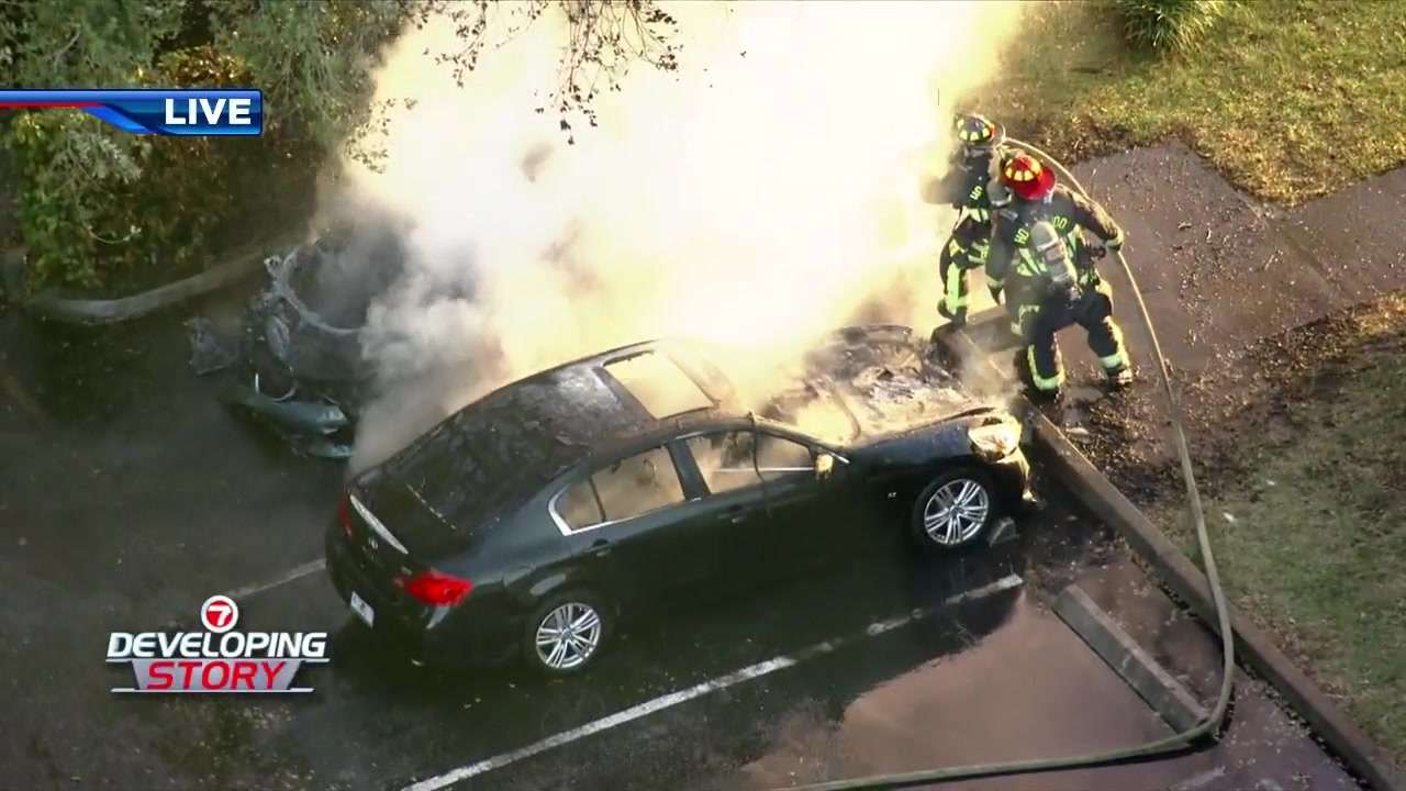 Firefighters battle blaze as 2 cars ignite outside apartment complex in ...
