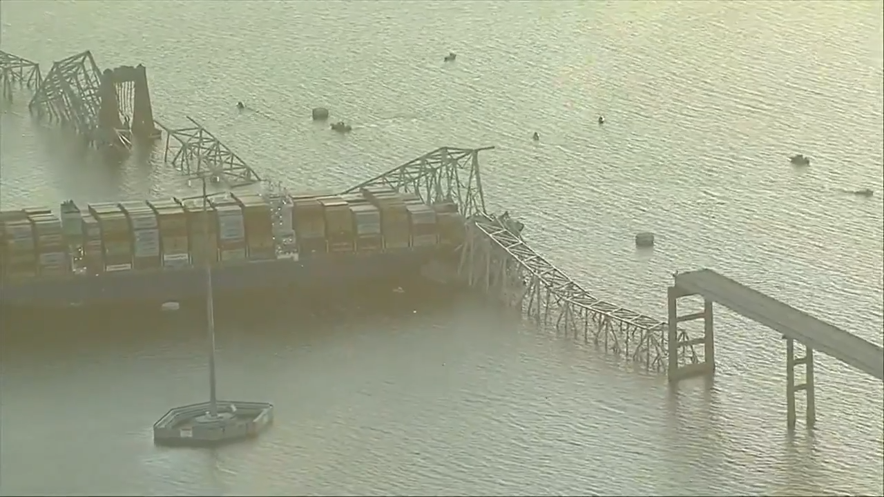 Cargo ship hits Baltimore’s Key Bridge, bringing it down. Rescuers are looking for people in water