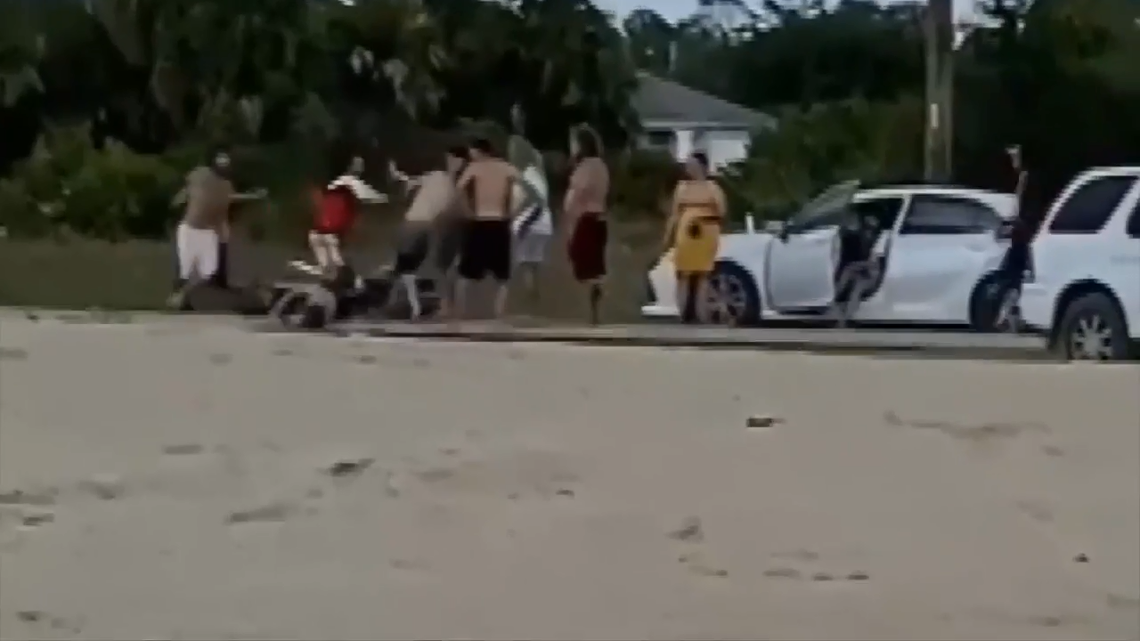 Brawl erupts on Florida beach after dirt biker crashes with family