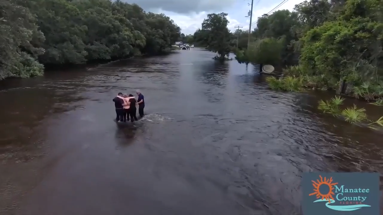 A TV reporter was doing a live hurricane report when he rescued a woman