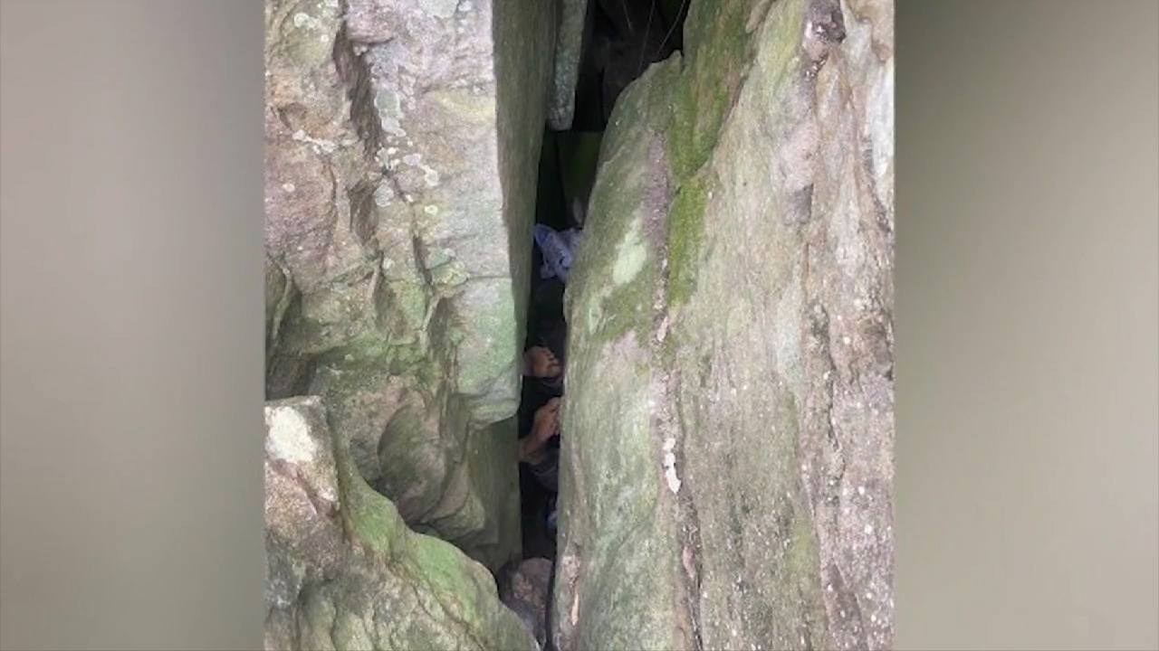 Woman wedged upside down between rocks for 7 hours after trying to retrieve her phone WSVN