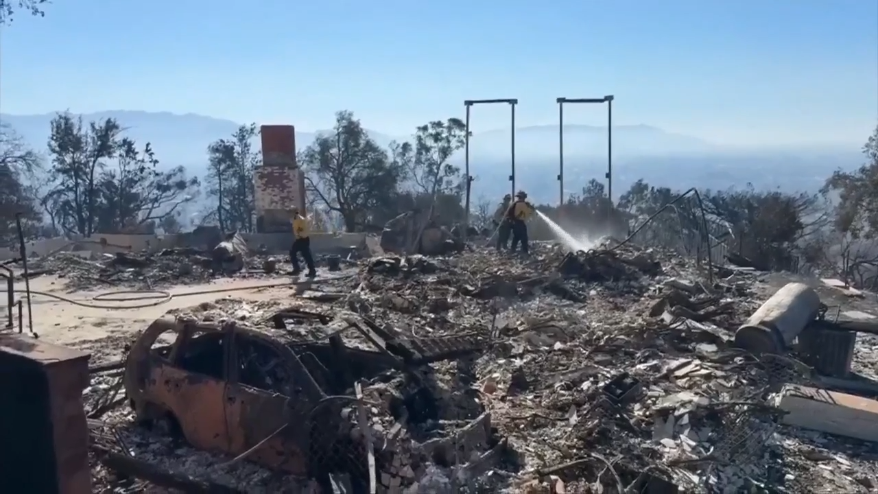 Fire crews on both US coasts battle wildfires, 1 dead; Veterans Day ...