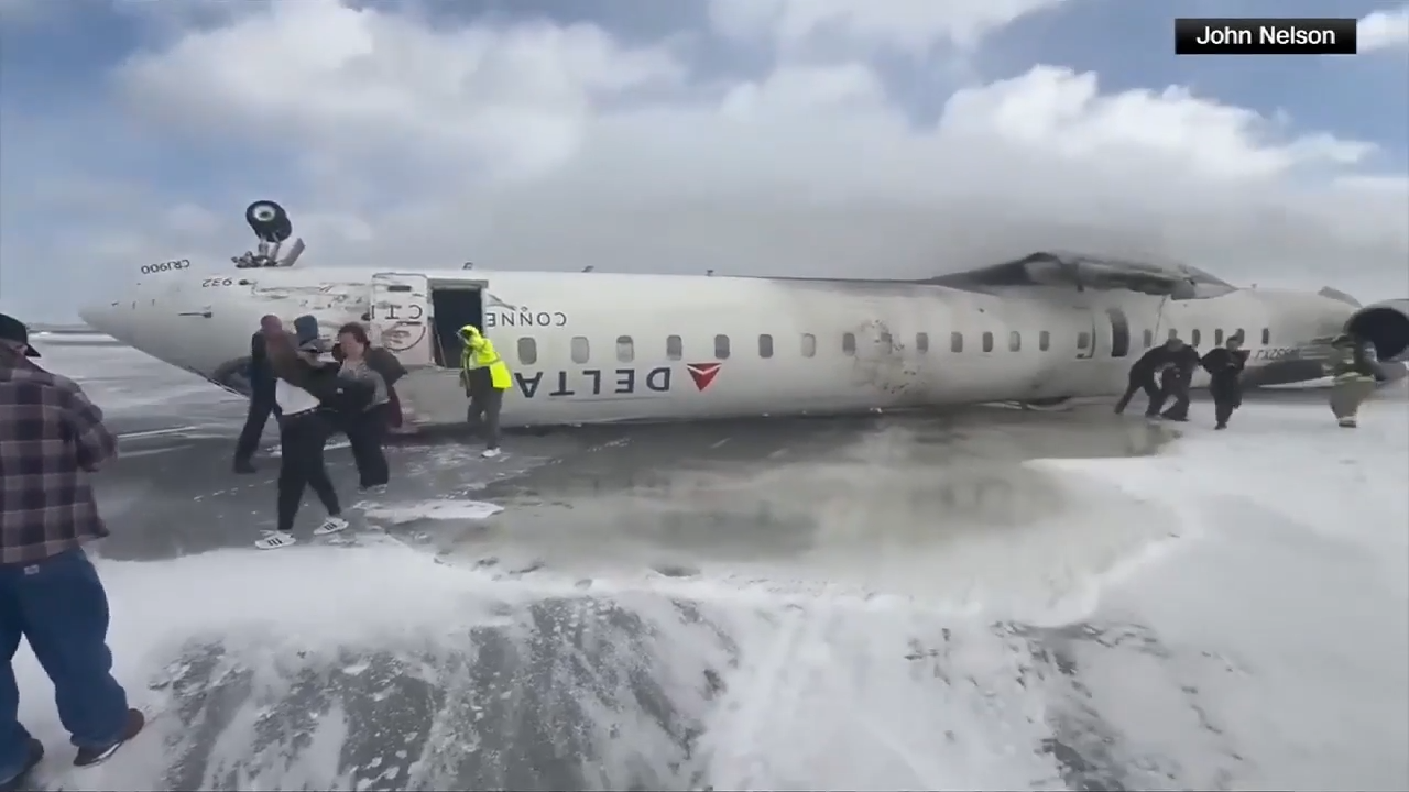 Delta jet flips upside down on a snowy Toronto runway and all 80 aboard