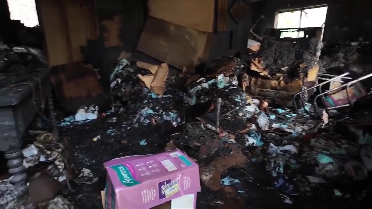 Neighbors run into burning trailer home to save woman during New