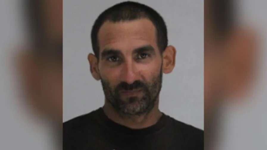 Man beheaded in machete attack at motel, witness says; suspect in ...