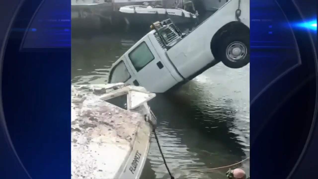 Driver of waste management truck that crashed into Miami River cited for careless driving