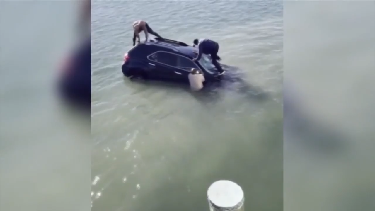 Daring rescue after woman drives into water in Virginia Beach