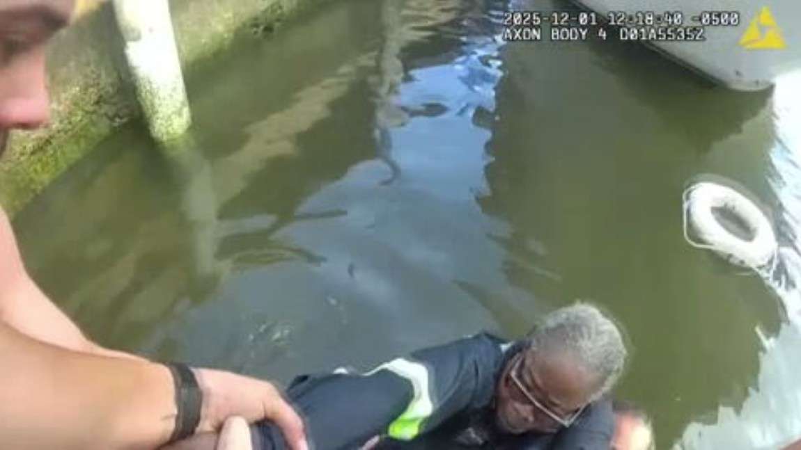 Bodycam video shows officer, good Samaritan rescuing driver from pickup ...