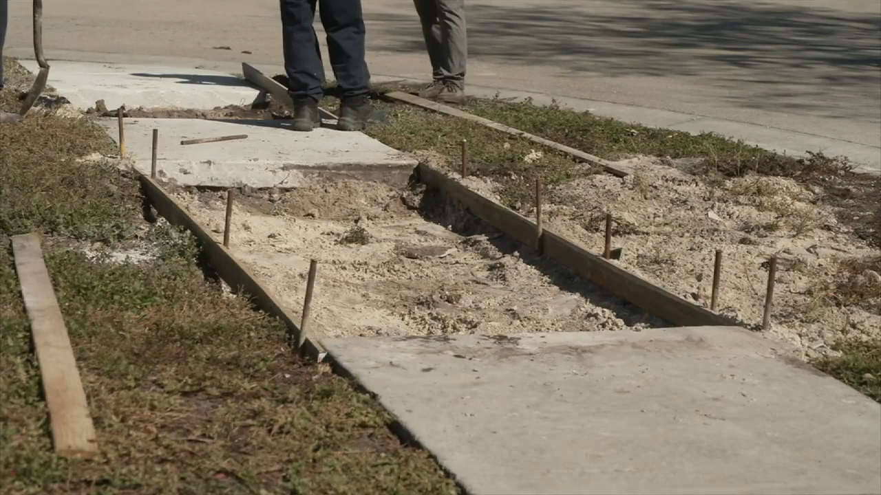 South Florida teacher caught between HOA and city over sinking sidewalk