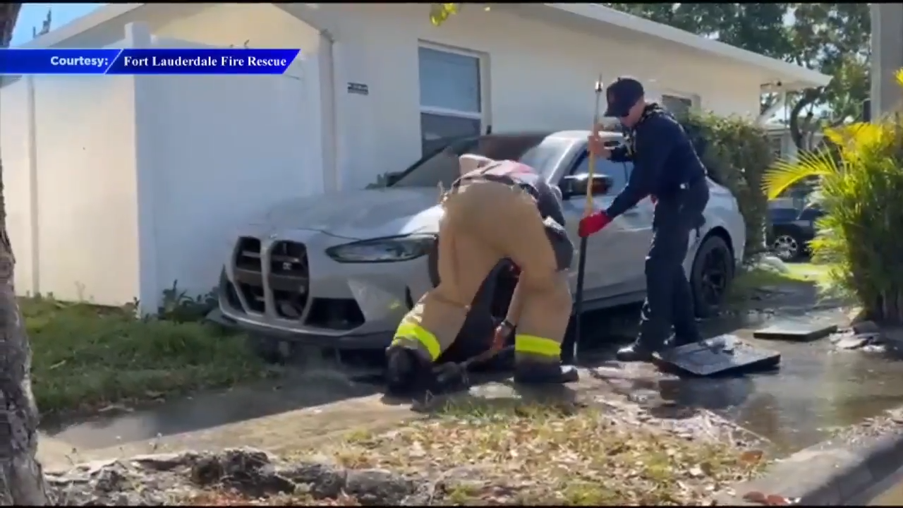 Water line bursts after car crashes into side of Fort Lauderdale ...