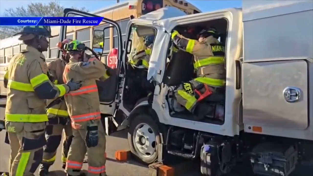 Truck driver extricated after crash with bus in NW Miami-Dade; 3 hospitalized