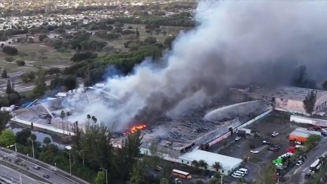 Crews make progress as massive warehouse fire near Turnpike in NW Miami ...