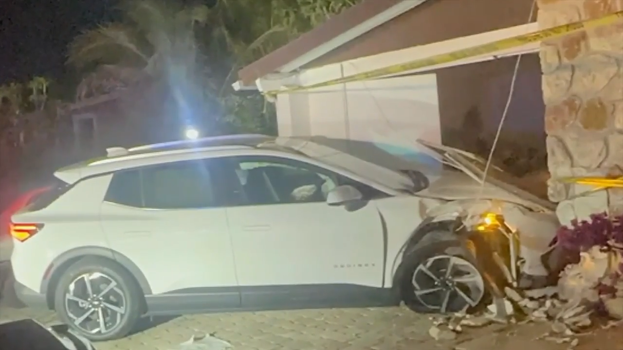 Security footage shows car plowing into carport after driver loses control; family speaks out