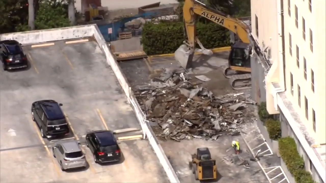 Crews clean up collapsed awning in Hallandale Beach that left 2 cars smashed