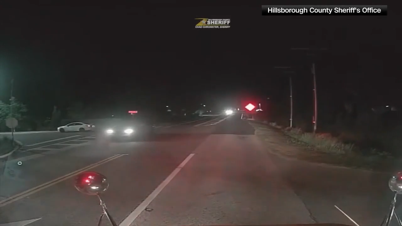 Driver issued warning after video shows them illegally passing stopped bus nearly hitting child in Riverview