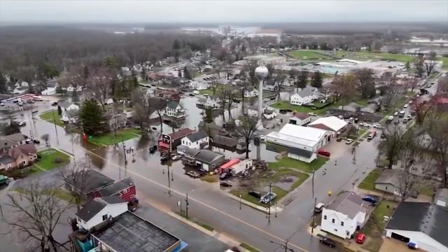 Floodwaters inundate Wisconsin streets, trapping drivers, as Midwest rebuilds after storms