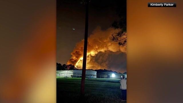 A well site explosion triggers a large fire and evacuations in Texas, but no injuries