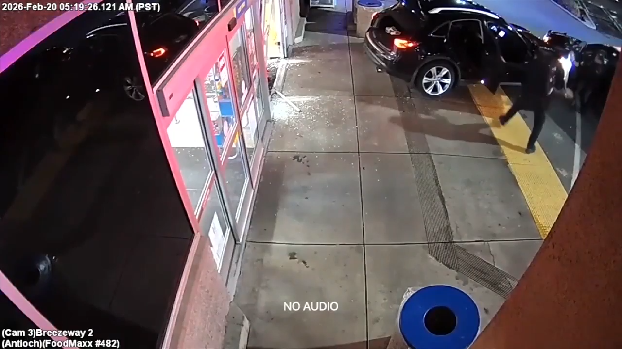 Video shows robbery suspect driving away from scene with police officer still inside