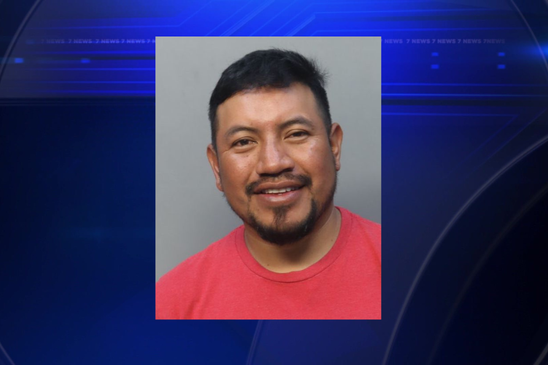 Woman strangled by man while holding child, police say