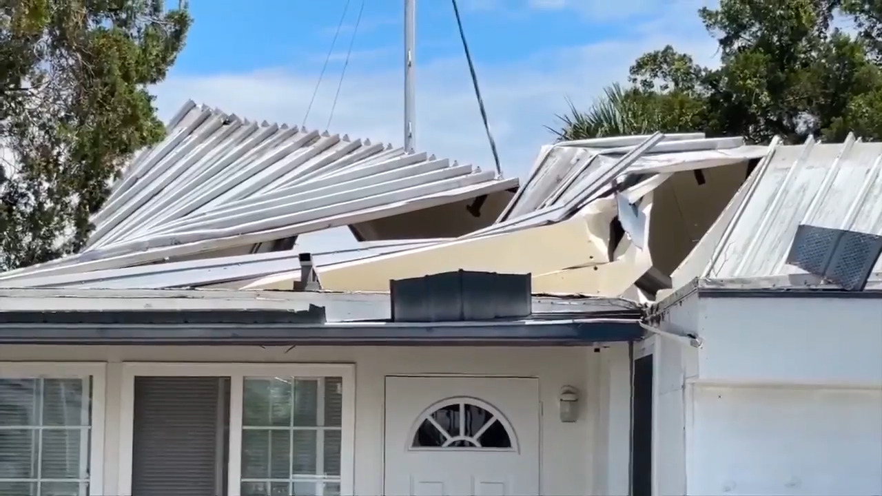 2 tornadoes touch down near Tampa, causing minor damage; no injuries reported